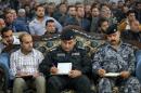 Iraqi police officers and cafe owners attend a seminar suggesting measures to stop a suicide bomber for owners of coffee shops, November 30, 2013, in Baghdad