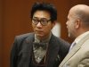 Young Lee, one of the founders of the Pinkberry yogurt chain stands with his attorney Philip Kent Cohen, right, during his arraignment in the Los Angeles Criminal Courts Building in Los Angeles, Monday, Jan. 30, 2012. City News Service says Lee was arraigned in the June 15 beating that left a homeless man with a broken forearm and cuts to his head. (AP Photo/Los Angeles Times, Al Seib, Pool)