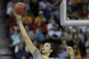 Baylor's Brittney Griner (42) catches a pass over Tennessee's Glory Johnson, left, and Vicki Baugh, right, during the first half of an NCAA women's college basketball tournament regional final, Monday, March 26, 2012, in Des Moines, Iowa. (AP Photo/Charlie Neibergall)
