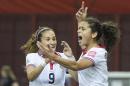 Costa Rica's Raquel Rodriguez Cedeno, right, celebrates with teammate Carolina Venegas (9) after scoring against Spain during first half FIFA World Cup soccer action in Montreal, Canada, Tuesday, June 9, 2015. (Graham Hughes/The Canadian Press via AP) MANDATORY CREDIT