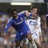 Chelsea's Mikel is fouled by Birmingham City's Craig Gardner during their English Premier League soccer match at Stamford Bridge in London