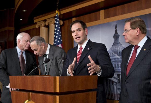 FILE – In this Jan. 28, 2013, file photo Sen. Marco Rubio, R-Fla., center, speaks at a Capitol Hill news conference on immigration legislation with a members of a bipartisan group of leading senators, including, from left, Sen. John McCain, R-Ariz., Sen. Chuck Schumer, D-N.Y. and Sen. Robert Menendez, D-N.J., in Washington. After months of arduous closed-door negotiations, the “Gang of Eight” senators equally divided between the two parties had no issues left to resolve in person, and no more negotiating sessions were planned. Remaining details were left to aides, who were at work completing drafts of the bill. (AP Photo/J. Scott Applewhite, File)