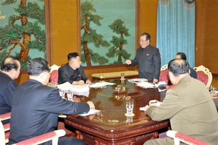 North Korean leader Kim Jong-Un (C) presides over a consultative meeting with officials about state security and foreign affairs in this undated recent picture released by North Korea's official KCNA news agency in Pyongyang on January 27, 2013. REUTERS/KCNA