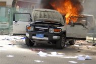 A vehicle burns at the U.S. embassy in Sanaa September 13, 2012. REUTERS/Mohamed al-Sayaghi