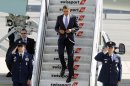 President Barack Obama arrives at John F. Kennedy International Airport, Monday, July 30, 2012, in New York. (AP Photo/Jason DeCrow)