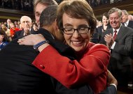 U.S. President Barack Obama hugs Representative Giffords  prior to his State of the Union address to a joint session of Congress on Capitol Hill in Washington,