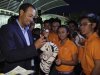 U.S. golfer Tiger Woods signs autographs for students after a coaching session in Singapore