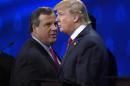 FILE - In this Oct. 28, 2016 file photo, New Jersey Gov. Chris Christie and Donald Trump talk during a break in the CNBC Republican presidential debate at the University of Colorado in Boulder, Colo. Christie had better be hungry: He's got a lot of harsh words to eat about Trump now that he's endorsed the billionaire. Trump, in turn, has some tough things about Christie to start walking back now that the two men are suddenly allies instead of antagonists in the Republican presidential race. (AP Photo/Mark J. Terrill, File)