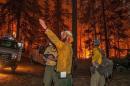 Firefighters prepare to battle the Wolverine wildfire near Chelan, Washington