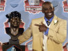 Deion Sanders poses with a bust of himself during the induction ceremony at the Pro Football Hall of Fame, Saturday, Aug. 6, 2011, in Canton, Ohio. (AP Photo/Tony Dejak)