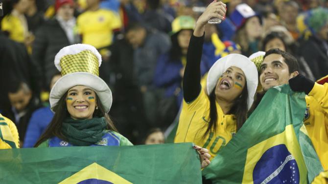 Brazil fans take selfies ahead of their team&#39;s first round Copa America 2015 soccer match against Colombia at Estadio Monumental David Arellano in Santiago