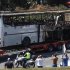 A truck carries a bus, that was damaged in a bomb blast on Wednesday, outside Burgas Airport