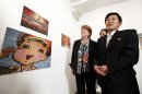 Associated Press Senior Vice President and Executive Editor Kathleen Carroll, left, and Korean Central News Agency Senior Vice President Kim Chang Gwang tour the gallery during an opening reception for the Window on North Korea: Photographs from the DPRK photo exhibit, Thursday, March 15, 2012, in New York. The exhibit, which marks 100 years since the birth of former North Korean leader Kim Il Sung, is a joint exhibition by The Associated Press and the Korean Central News Agency. (AP Photo/Jason DeCrow)