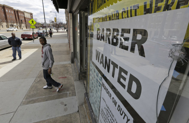 FILE - This Friday, March 29, 2013 file photo shows a help wanted sign at a barber shop in Richmond, Va. U.S. employers added just 88,000 jobs in March, the fewest in nine months and a sharp retreat after a period of strong hiring. Many discouraged Americans are giving up the job hunt for school, retirement and disability. (AP Photo/Steve Helber, File)