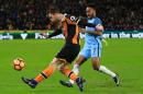Hull City defender Andrew Robertson (L) vies with Manchester City midfielder Raheem Sterling during the English Premier League football match between Hull City and Manchester City at the KCOM Stadium on December 26, 2016