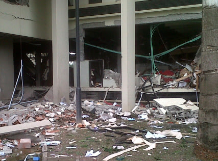 This image released by Saharareporters shows debris after a large explosion struck the United Nations' main office in Nigeria's capital Abuja Friday Aug. 26, 2011, flattening one wing of the building 