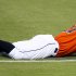 Miami Marlins' Giancarlo Stanton holds his head after being injured in the 10th inning of a baseball game against the New York Mets at Marlins Park in Miami on Monday, April 29, 2013. (AP Photo/The Miami Herald, Joe Rimkus Jr.)