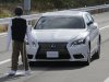 Toyota's Lexus LS stops automatically in front of a dummy during a Toyota Motor Corp. demonstration of the pre-collision system (PCS) at its Higashi-Fuji Technical Center in Susono, southwest of Tokyo, Monday, Nov. 12, 2012. The PCS, one of the automaker's pedestrian accident countermeasures, watches out for pedestrians to avoid collisions with them. (AP Photo/Koji Sasahara)