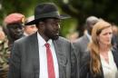 South Sudan President Salva Kiir (L) takes US Ambassador to the UN Samantha Power on a tour of the state house to show damage from fighting in July