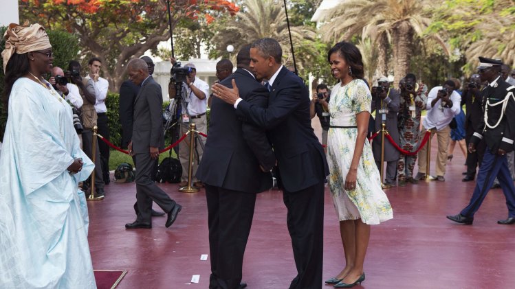 U.S. President Obama greets Senegalese President Sall as U.S. first lady Michelle and Senegalese First Lady Faye Sall look on, at presidential palace in Dakar
