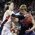 Gonzaga's Kelly Olynyk, left, tries to strip the ball from Saint Mary's Matt Hodgson during the first half of the West Coast Conference tournament championship NCAA college basketball game, Monday, March 11, 2013, in Las Vegas. (AP Photo/Julie Jacobson)