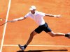 USA's John Isner hits a return to France's Jo Wilfried Tsonga during their Davis cup tennis match