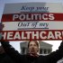 Amy Brighton from Medina, Ohio, who opposes health care reform, rallies in front of the Supreme Court  in Washington, Tuesday, March 27, 2012, as the court continues arguments on the health care law signed by President Barack Obama. (AP Photo/Charles Dharapak)
