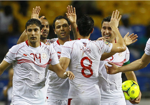 Tunisia soccer players celebrate after scoring a goal against Morocco during their African Cup of Nations Group C soccer match at Stade De L'Amitie in Libreville, Gabon, Monday, Jan. 23, 2012. (AP Photo/Francois Mori)