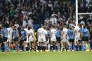 Players shake hands after the Rugby World Cup Pool A match between England and Uruguay at Manchester City Stadium, Manchester, England, Saturday, Oct. 10, 2015. England won the match 60-3. (AP Photo/Jon Super)