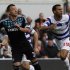 Queens Park Rangers' Anton Ferdinand and Chelsea's John Terry run for the ball during their FA Cup soccer match at Loftus Road in London