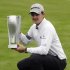 Justin Rose holds the BMW trophy after he won the final round at the BMW Championship golf tournament on Sunday, Sept. 18, 2011, in Lemont, Ill. Rose finished total 13 under. (AP Photo/Nam Y. Huh)