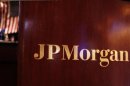 Flag hangs on the wall of the JP Morgan company stall on the floor of the New York Stock Exchange in New York