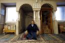 Jamal Habbachich, who heads a council of 22 Molenbeek mosques, poses for a picture at Attadamoun Mosque in the neighbourhood of Molenbeek
