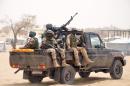Nigerien soldiers patrol in a truck at Kabalewa Refugees Camp, where Nigerians fleeing from Boko Haram Islamists attacks are sheltered in Diffa, Niger, March 13, 2015