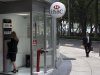 A woman uses a cash machine at the HSBC bank headquarters in Mexico City, Wednesday, July 25, 2012.  Mexican regulators have levied a $28 million fine against the Mexico subsidiary of London-based HSBC bank for failing to prevent money laundering through accounts at the bank. (AP Photo)