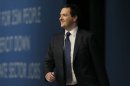 Britain's Chancellor of the Exchequer George Osborne takes to the stage to deliver his keynote speech at the annual Conservative party conference in Manchester, northern England