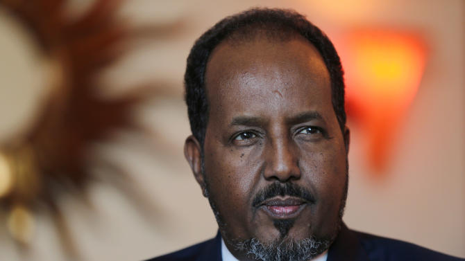 Somali President Hassan Sheikh Mohamud , talks to the Associated Press while visiting Dubai in the United Arab Emirates for a conference on African business opportunities in Dubai, United Arab Emirates, Tuesday, Nov. 17, 2015. Somalia’s president said Tuesday that al-Qaida and the Islamic State group are merely the same “evil force” that the world needs to confront in the wake of the attacks on Paris.  (AP Photo/Kamran Jebreili)