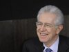 Italian Prime Minister Mario Monti smiles during a news conference in Rome