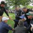 Phil Mickelson, left, consoles a fan while she is tended to after being struck in the head by Mickelson's approach shot on the 16th hole during the third round of the Wells Fargo Championship golf tournament at Quail Hollow Club in Charlotte, N.C., Saturday, May 4, 2013. (AP Photo/Chuck Burton)