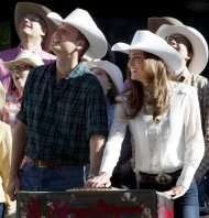 Prince William and Kate, the Duke and Duchess of Cambridge push the button to officially start the Calgary Stampede parade in Calgary, Alberta, Canada on Friday July 8, 2011. (AP Photo/The Canadian Press, Jonathan Hayward)