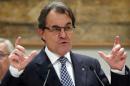Catalan regional government head Artur Mas gestures during the "Audience to Catalan Motorcycling Champions" at Palau de la Generalitat in Barcelona