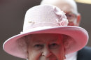 Britain's Queen Elizabeth II smiles during her visit to the Manchester Central convention centre, Manchester, England, Friday, March 23, 2012. (AP Photo/Jon Super, Pool)