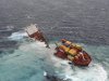 In this Sunday, Jan. 8, 2012 photo provided by Maritime New Zealand, the stranded cargo ship Rena breaks in two pieces after overnight storms with 19 foot, (six meter) waves pounding the vessel, off Tauranga Harbor, New Zealand. The Greek-owned Rena ran aground on Astrolabe Reef 14 miles (22 kilometers) from Tauranga Harbor on North Island on Oct. 5, 2011, spewing heavy fuel oil into the seas in what has been described as New Zealand's worst maritime environmental disaster. (AP Photo/Maritime New Zealand) EDITORIAL USE ONLY