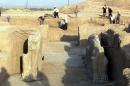 A picture taken on July 17, 2001 shows Iraqi workers cleaning an archeological site in Nimrud