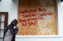 A person walks by a sign warning about Hurricane Isaac, in Key West, Fla., Sunday, Aug. 26, 2012. Isaac gained fresh muscle Sunday as it bore down on the Florida Keys, with forecasters warning it could grow into a dangerous Category 2 hurricane as it nears the northern Gulf Coast. (AP Photo/Alan Diaz)