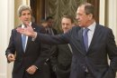 Russian Foreign Minister Sergey Lavrov, right, gestures as he greets U.S. Secretary of State John Kerry, left, during their meeting in Moscow, Russia, Tuesday, May 7, 2013. Secretary of State John Kerry on Tuesday argued the U.S. case to Russian President Vladimir Putin for Russia to take a tougher stance on Syria at a time when Israel's weekend air strikes against the beleaguered Mideast nation have added an unpredictable factor to the talks. (AP Photo/Misha Japaridze)