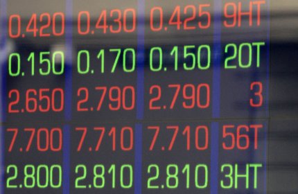 A man watches news on display boards at the Australian Stock market in Sydney, Australia, Thursday, Aug. 11, 2011. Asian markets headed sharply lower early Thursday over mounting concerns about the health of Europe's banks and France's debt rating. (AP Photo/Rick Rycroft)