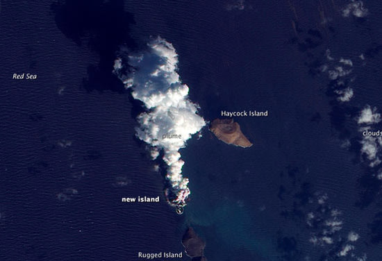 A plume rises from a new island in the Red Sea on Dec. 23, 2011 in this satellite view. The smoke plume and new island were created in a volcanic eruption in December 2011. CREDIT: NASA Earth Observatory