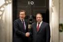British Prime Minister David Cameron (L) greets Pakistan's Prime Minister Nawaz Sharif outside 10 Downing Street in central London, on April 30, 2014