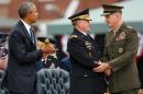 President Barack Obama watches as newly sworn-in Joint Chiefs Chairman Gen. Joseph Dunford Jr., right, shakes hands with retiring Joint Chiefs Chairman Gen. Martin Dempsey during his Armed Forces Full Honors Retirement Ceremony for Dempsey, Friday, Sept. 25, 2015, at Fort Myer in Arlington, Va. (AP Photo/Andrew Harnik)